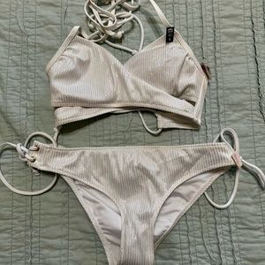 NWT: Beautiful Victoria’s Secret bathing White shimmer bikini. Size small.
